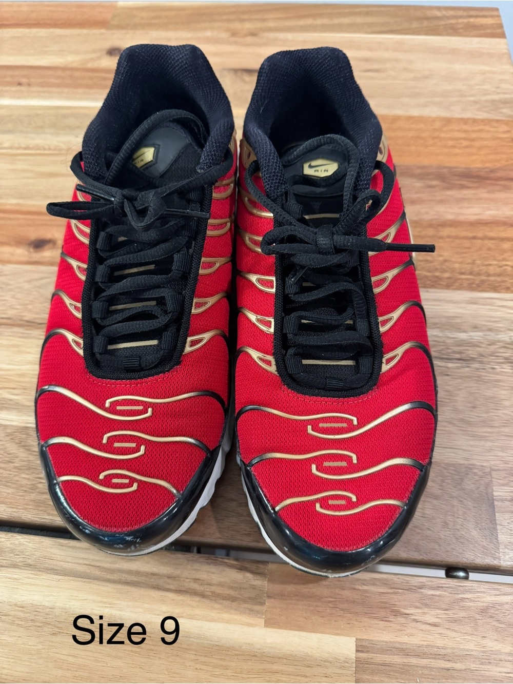 Nike Red and Black Athletic Sneakers with Gold Accents